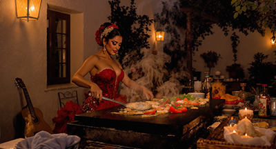 Während die Platte heiß wird, bereitet Carmen ihre Spezialität vor